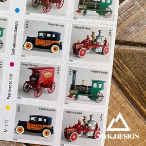 May include: Sheet of self-adhesive stamps featuring vintage vehicle illustrations. Stamps include images of a green train, a red and black car, and a red tractor. Each stamp is marked "First-Class" and "2002 USPS".
