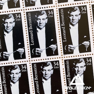 May include: A sheet of postage stamps featuring a black and white portrait of Leonard Bernstein. Each stamp has the text "Leonard Bernstein" and "34 USA". The stamps are arranged in a grid pattern.