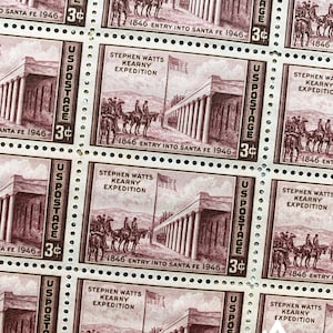 May include: Four vintage US postage stamps featuring a brown illustration of the Stephen Watts Kearny Expedition entering Santa Fe in 1846. The stamps are 3 cents each and have the text "US Postage" printed on them.