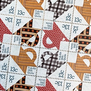 May include: A collection of 13 cent postage stamps featuring a quilt design with the text "Folk Art USA: Quilts".