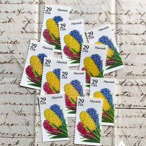 May include: Ten vintage US postage stamps featuring a hyacinth flower design. Each stamp is 29 cents and features the text "Hyacinth" and "USA".