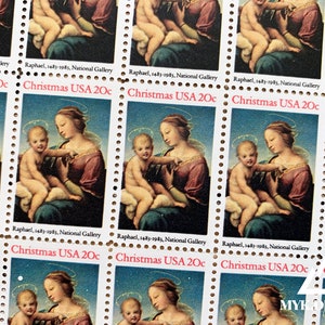 May include: A sheet of Christmas postage stamps featuring a Renaissance painting of a mother and child. The stamps are labeled "Christmas USA 20c" and include the text "Raphael, 1483-1983, National Gallery."