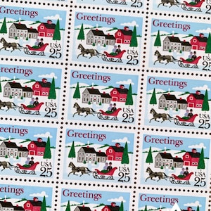 May include: Sheet of USA 25-cent postage stamps featuring a winter scene. Each stamp shows a horse-drawn sleigh, a red barn, and a house. The word "Greetings" is printed at the top of each stamp.