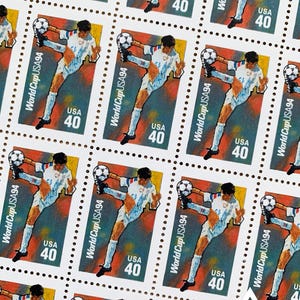 May include: A sheet of 10 US postage stamps featuring a soccer player kicking a ball. The stamps are white with a red, blue, and yellow design. Each stamp says "World Cup USA94" and "USA 40".