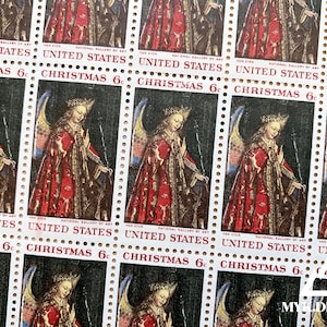 May include: A sheet of vintage Christmas stamps featuring a painting of a woman in a red robe with a crown. The stamps are from the National Gallery of Art and say "United States Christmas 6c".
