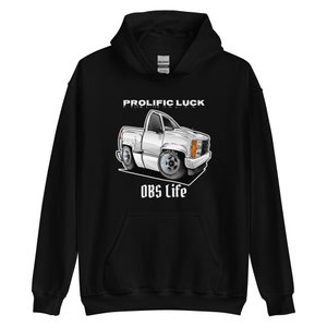 May include: Black hooded sweatshirt with a white cartoon illustration of a pickup truck and the text "Prolific Luck Pickup Artist" and "OBS Life".