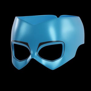 May include: A light blue superhero mask with a metallic finish. The mask has large eye openings outlined in black and a pointed design at the forehead and chin. The mask is set against a black background.