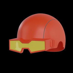 Op de afbeelding: Een 3D-geëngineerde oranje helm met gele vizierglazen. De helm heeft een afgeronde bovenkant met een dun grijs lijndetail. Het vizier is rechthoekig met een gele lens en een oranje frame. De achtergrond is zwart.