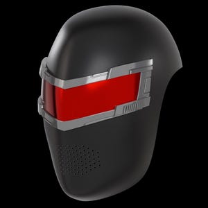 May include: Black helmet with a red visor and silver accents. The helmet has a rounded shape with a series of small holes near the bottom. The visor is rectangular and framed by silver detailing.