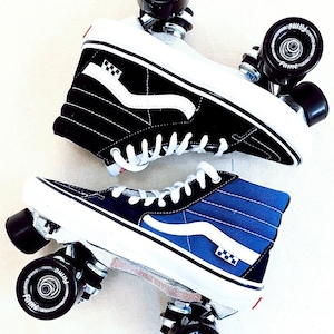 May include: A pair of black and blue high-top Vans sneakers with white checkerboard accents, modified into roller skates with black wheels and silver frames.
