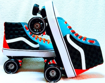May include: Black and white checkered Vans high-top sneakers with blue and orange accents, modified into roller skates with black wheels and "MACH-5" printed on the wheels.