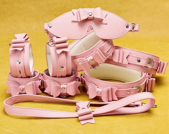Pinkes Leder-Bondage-Set, Schleifenhalsband, Augenbinde, Oberschenkel-, Knöchel- und Handgelenksfesseln DDLG 9-teilig