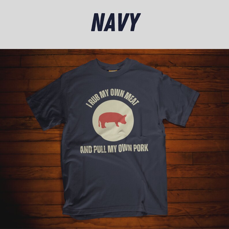 May include: A navy blue t-shirt with a white circle and a red pig silhouette. The text "I rub my own meat and pull my own pork" is printed on the shirt.