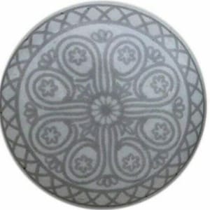 May include: Two white ceramic cabinet knobs with a gray floral design. The knobs have a round shape with a decorative pattern around the edge and a central floral motif. Each knob has a metal screw for installation.