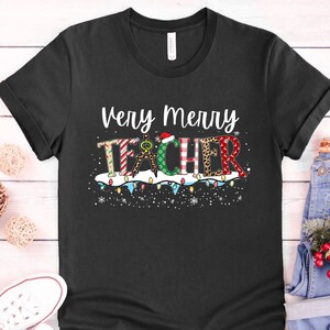 Teacher Christmas Shirt, Teacher&#39;s Christmas Shirt, Teachers Christmas Tshirt, Merry Teacher Shirt, Christmas Tee, Santas Helper Shirt