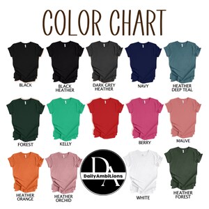 May include: Color chart showing 12 different t-shirt colors, including black, navy, forest green, kelly green, heather orange, heather orchid, and white. The chart also includes the text "Daily Ambitions".