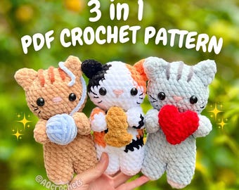 May include: Three crocheted cat toys in a row, each with unique features. One is tan with a blue yarn ball, another is white with orange and black markings, and the last is gray holding a red heart. The text "3 in 1 PDF CROCHET PATTERN" is above them.