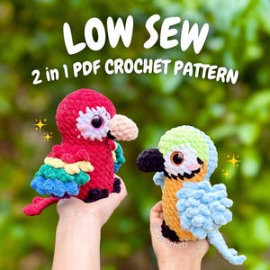 May include: Two plush crochet parrots, one primarily red with a beige beak and the other light blue, yellow, and green with a black beak. The text LOW SEW 2 in 1 PDF CROCHET PATTERN is displayed above the toys, which feature large plastic eyes.