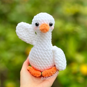 silly goose crochet pattern, low sew silly goose crochet pattern, amigurumi goose, goose wearing traffic cone hat, goose wearing frog hat, goose wearing flower hat, amigurumi bird pattern, cute crochet pattern