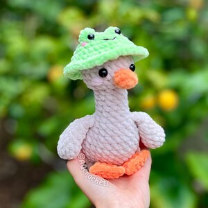 silly goose crochet pattern, low sew silly goose crochet pattern, amigurumi goose, goose wearing traffic cone hat, goose wearing frog hat, goose wearing flower hat, amigurumi bird pattern, cute crochet pattern