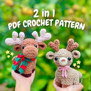 May include: Two crocheted reindeer, one with a red and green scarf and the other with a pink bow, are held up against a blurred green background. The text "2 in 1 PDF CROCHET PATTERN" is displayed above the reindeer.