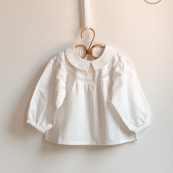 Pure white cotton blouse for babies and girls. Elegant blouse for girls. Shirts with long sleeves and elastic at the cuffs. Girls clothing