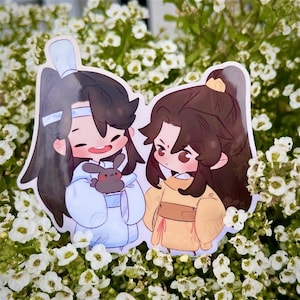 May include: Two cartoon characters, one in a blue and white outfit holding a small brown bunny, and the other in a yellow outfit, are depicted in a sticker format. The stickers are placed on a background of white flowers.