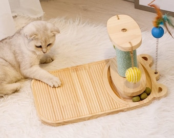 Giocattolo interattivo tiragraffi per gatti con palla di legno e menta