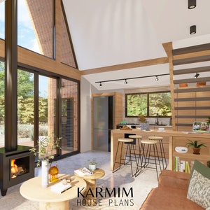 May include: A modern, open-concept kitchen and living room with a wood-burning stove, a large window, and a wooden countertop with bar stools. The room has a high ceiling with exposed beams and a large window that lets in natural light. The text "KARMIM HOUSE PLANS" is visible in the bottom center of the image.