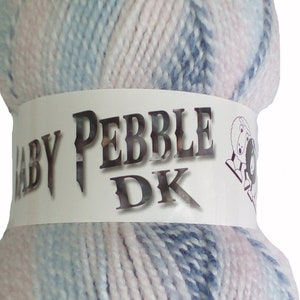 May include: A ball of Baby Pebble DK yarn in a blue and pink colorway. The yarn is wrapped around a white label with the text "Baby Pebble DK" on it.