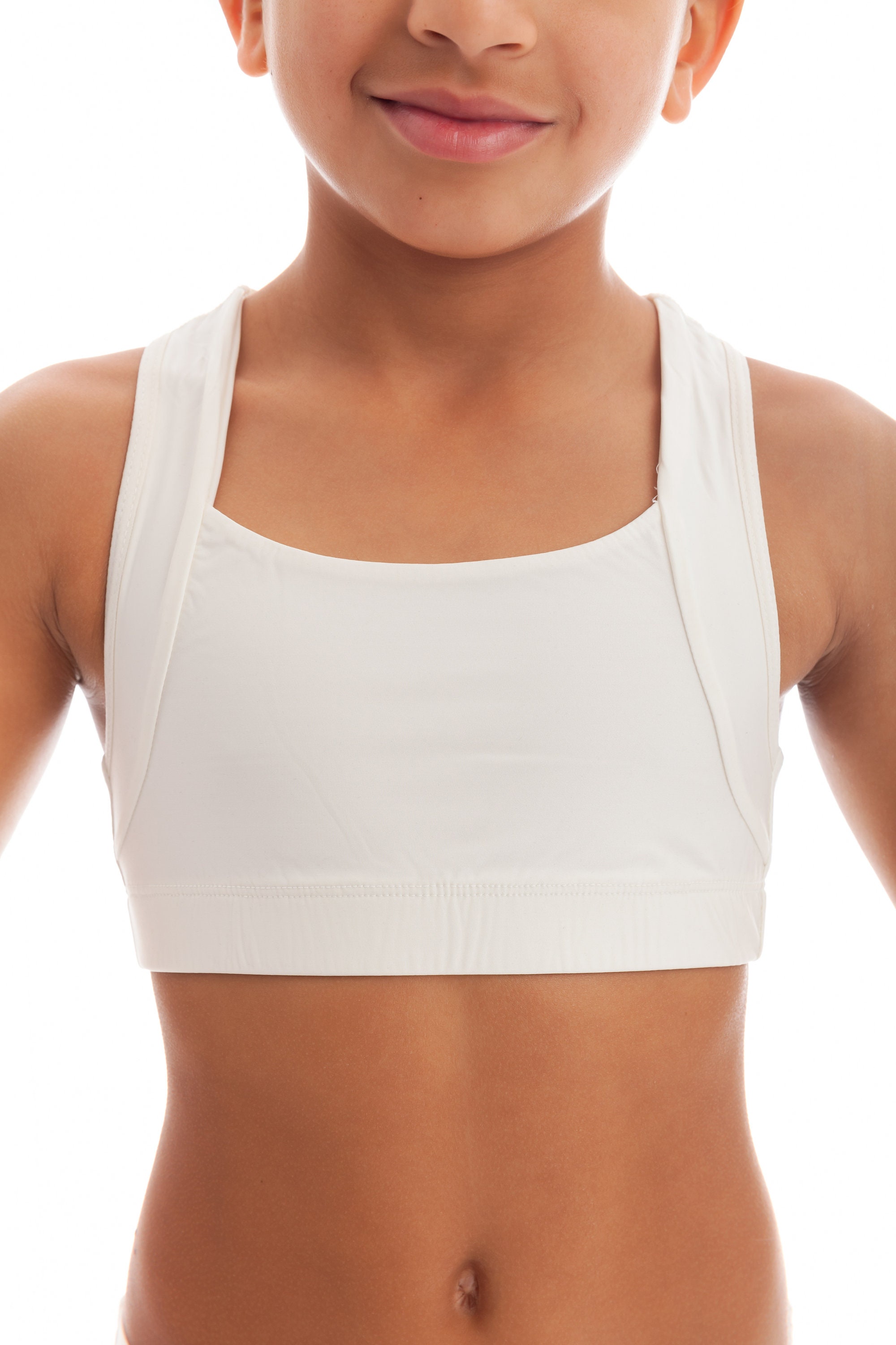 A Teenage Girl in a White Sports Bra and a White Shirt · Free