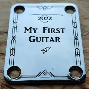 Custom laser engraved guitar neck plate
