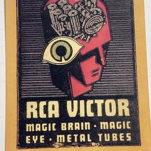 May include: Vintage RCA Victor advertisement featuring a stylized red head with a mechanical brain and an eye. The text includes "MAGIC BRAIN, MAGIC EYE, METAL TUBES". The background is black with horizontal lines, set on a yellowed card.