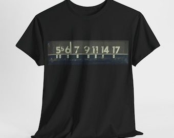 May include: Black t-shirt with a vintage-style graphic of a numbered sign. The sign reads "5 6 7 9 11 14 17".