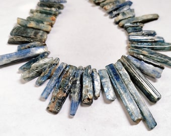 Contas de cianita azul natural: fio bruto de 10" (17 x 5 a 34 x 3 mm)