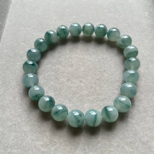 Icy Blue Jadeite Jade Beads Bracelet with Green Floating Flowers