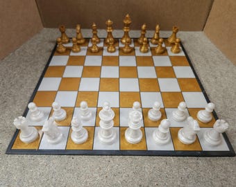 Staunton Gold And White Silver Chess Set and matching Board