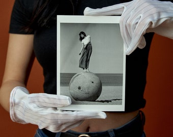 Darkroom print: Girl on a Ball postcard sized gelatine silver hand print on Ilford Multigrade RC gloss paper