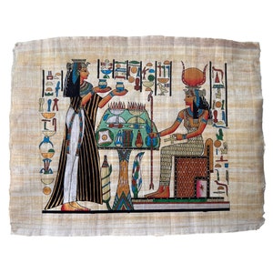 May include: A hand-painted papyrus scroll depicting two Egyptian goddesses. The goddess on the left is offering a cup to the goddess on the right, who is seated on a throne. The scroll is decorated with hieroglyphs and other Egyptian motifs.