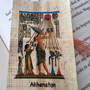 May include: A papyrus scroll featuring a colourful illustration of Akhenaton, an Egyptian pharaoh, offering a cup to the sun god. The scroll also includes hieroglyphic alphabet letters. The text on the scroll reads "Akhenaton Hieroglyphic Alphabet".
