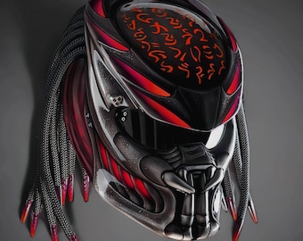 May include: A custom motorcycle helmet with a Predator design. The helmet features a black and silver color scheme with red accents. It has a detailed face mask, dreadlocks, and a visor. The top of the helmet has red alien script.