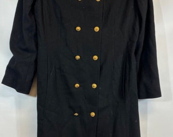 May include: A black double-breasted coat with gold buttons. The coat has a long, fitted silhouette and a high collar.