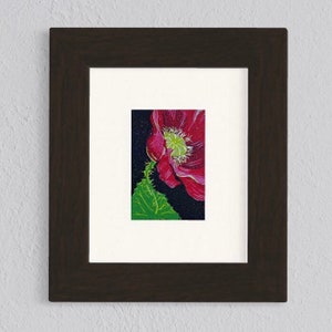 Linocut handmade print reduction layers in color showing a papaver flower with a leaf