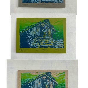 Linocut greeting card with traditional norwegian cabin and woman. Signed and numbered, in colors green blue and lightblue, other card background options in gray, green and brown