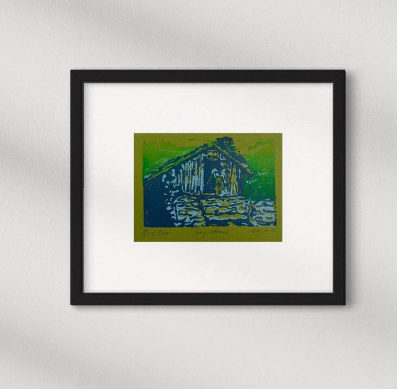 Linocut greeting card with traditional norwegian cabin and woman. Signed and numbered, in colors green blue and lightblue, green card