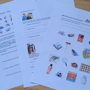 May include: Three sheets of white paper with English language learning activities. One sheet is titled "Talking About Interests - Conversation", another "Reading Writing Activity", and the third "What Will You Take To The Desert Island?"