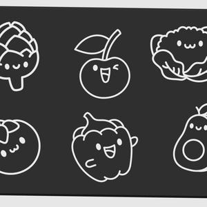 May include: A black rectangular surface with six white line-drawn illustrations of smiling fruits and vegetables. The illustrations include an artichoke, cherry, cauliflower, tomato, bell pepper, and avocado.