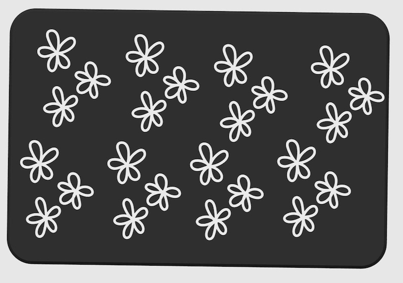 May include: A rectangular, dark gray surface with a pattern of white, five-petal flower shapes. The flowers are evenly spaced across the surface, creating a simple, yet elegant design. The edges of the surface are rounded.
