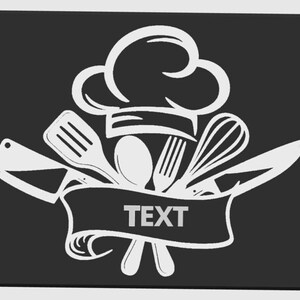 May include: A white chef's hat and kitchen utensils design on a black background. The design includes a chef's hat, spatula, spoon, fork, whisk, and knife. The word "TEXT" is in a banner below the utensils.