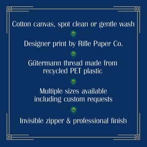 May include: Dark blue background with gold decorative border and white text. The text reads: Cotton canvas, spot clean or gentle wash. Designer print by Rifle Paper Co. G&uuml;termann thread made from recycled PET plastic. Multiple sizes available including custom requests. Invisible zipper & professional finish.